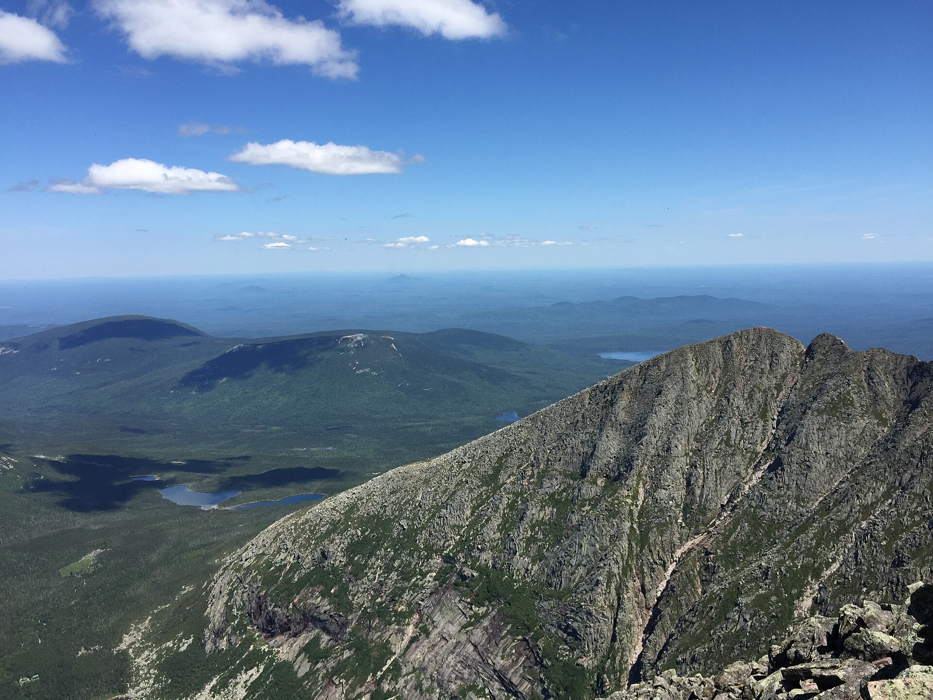 The narrow rock arête of Katahdin's Knife Edge running out toward Pamola Peak, with the Great Basin and its ponds far below
